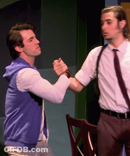 Man In Blue Vest Shaking Hands With Man In White Shirt And Tie GIF