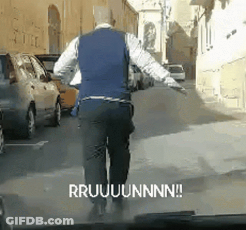 Man In Blue Vest Walking Saying Rruuuunnn GIF
