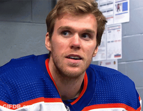 Man In Blue, White, And Orange Hockey Jersey GIF