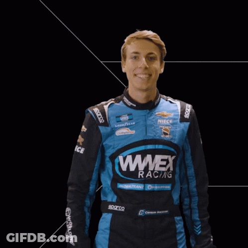 Man In Blue Wnex Racing Jacket Waving GIF