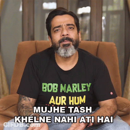 Man In Bob Marley T-Shirt Sitting In Chair GIF
