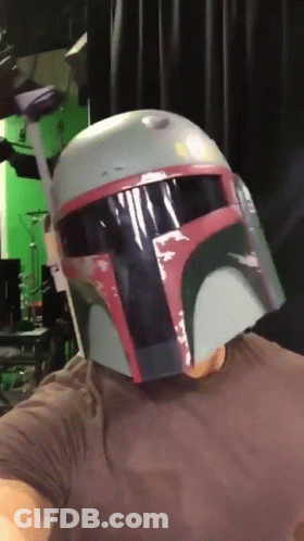Man In Boba Fett Helmet Looking At Camera GIF