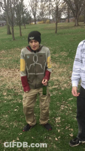 Man In Boba Fett Jacket Holding Green Bottle GIF