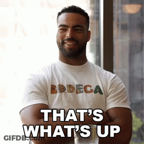 Man In Bodega T-Shirt Saying What's Up GIF