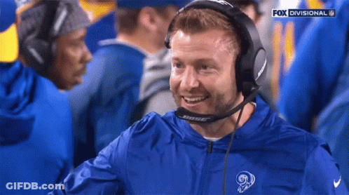 Man In Bose Headphones And Blue Jacket With Ram Logo GIF