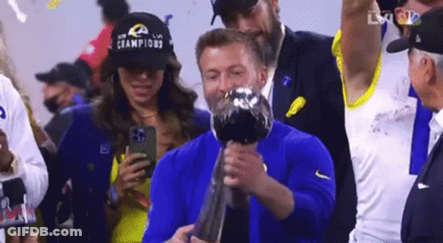 Man In Bose Headphones And Blue Jacket With Ram Logo GIF