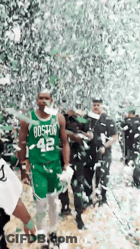 Man In Boston 42 Jersey Walking Through Crowd GIF