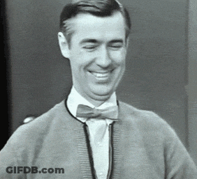 Man In Bow Tie And Sweater Smiling GIF