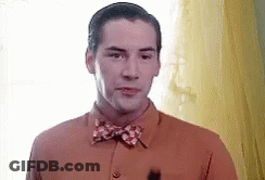 Man In Bow Tie At Window GIF