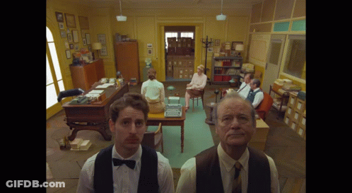 Man In Bow Tie Standing Before Crowd GIF