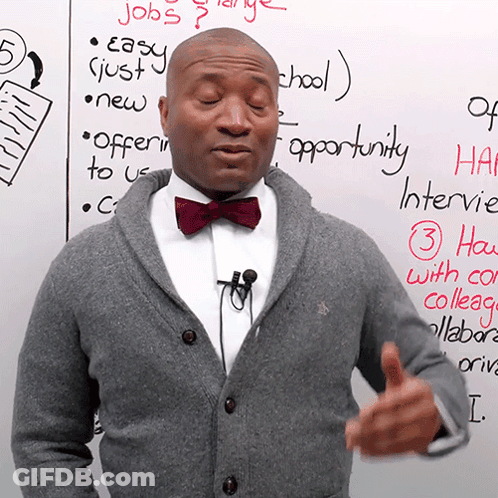 Man In Bow Tie Standing In Front Of Jobs GIF