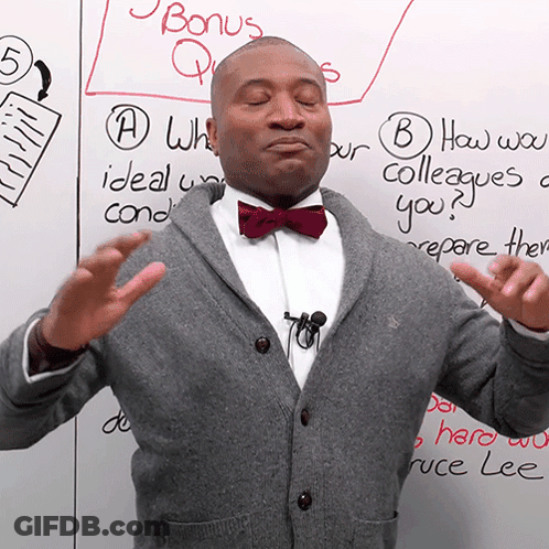 Man In Bow Tie With Bonus Questions Board GIF