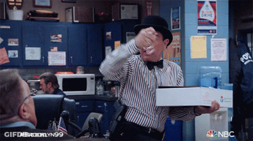 Man In Bowler Hat Holding Pizza GIF