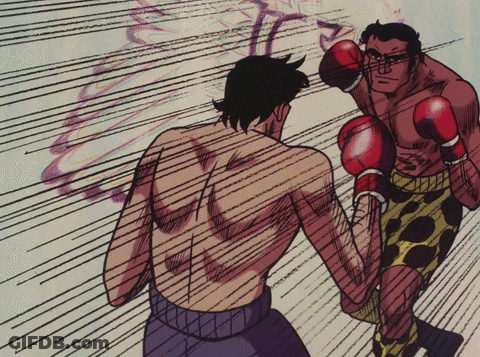 Man In Boxing Gloves Throws Punch At Another Man GIF