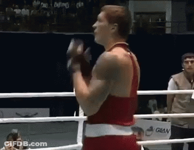 Man In Boxing Ring Holding Glove GIF