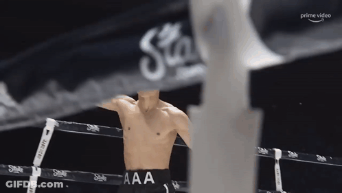 Man In Boxing Ring With AAA On Pants GIF