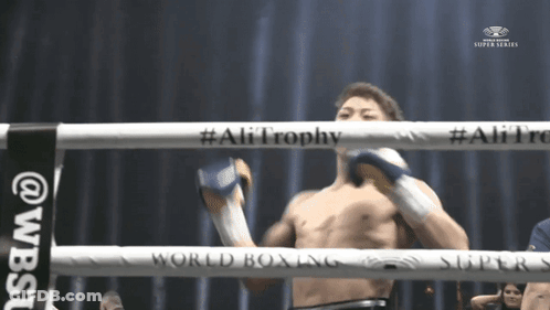 Man In Boxing Ring With Ali Trophy GIF