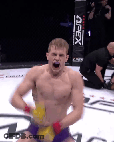 Man In Boxing Ring With Apex Sign GIF