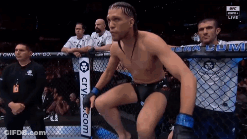 Man In Boxing Ring With CryL.com Sign GIF