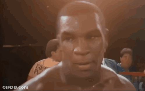 Man In Boxing Ring With Face Tattoo GIF