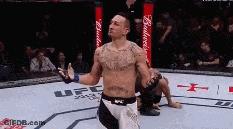 Man In Boxing Ring With Hands Up GIF