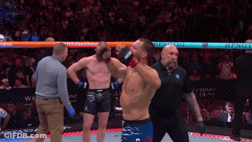 Man In Boxing Ring With Hypnotiq Sign GIF