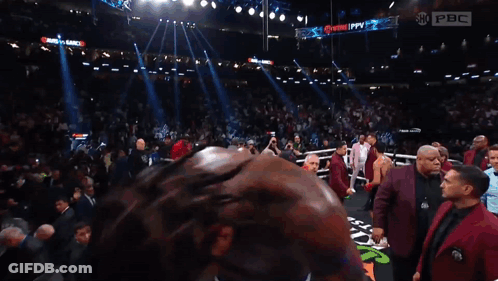 Man In Boxing Ring With PBC Sign GIF
