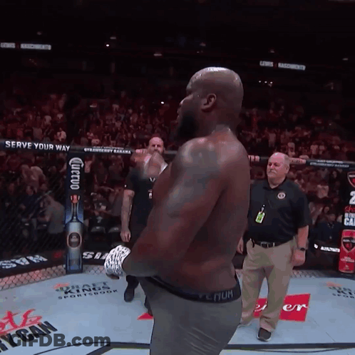 Man In Boxing Ring With Serve Your Way Sign GIF