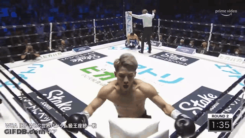 Man In Boxing Ring With Stake Ads GIF