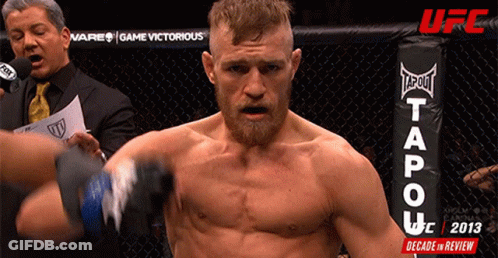 Man In Boxing Ring With Tapout Logo GIF