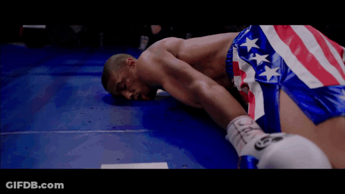 Man In Boxing Ring With Tecate Logo GIF