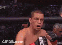 Man In Boxing Ring With UFC Glove GIF