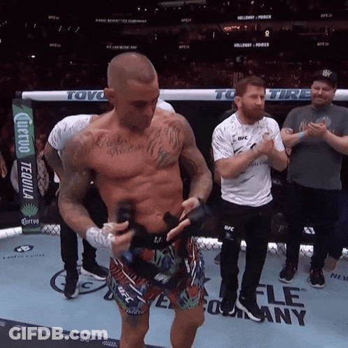 Man In Boxing Ring With UFC Sign GIF