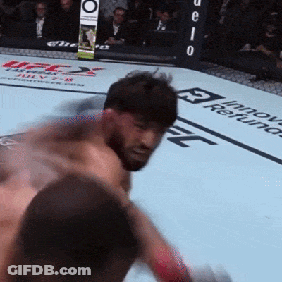Man In Boxing Ring With UFC Sign GIF