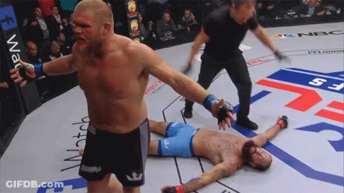 Man In Boxing Ring With Watch On Wall GIF