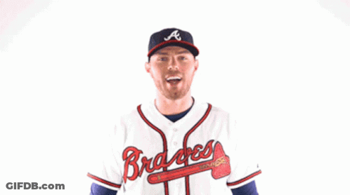 Man In Braves Jersey Flexing Arms GIF