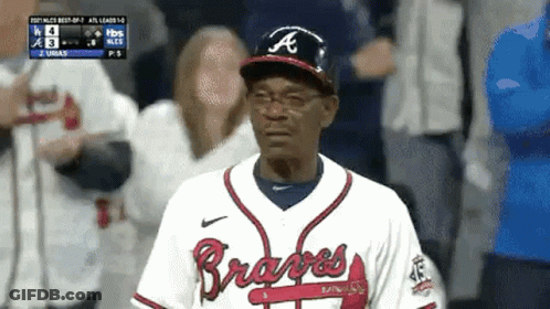 Man In Braves Uniform Standing In Dugout GIF