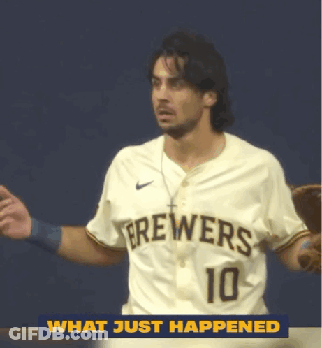 Man In Brewers Jersey Standing In Front Of Blue Wall GIF