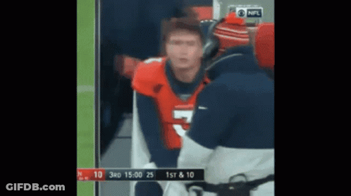 Man In Broncos Jersey Talking To Man In Blue Jacket GIF