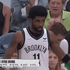 Man In Brooklyn Jersey Stands In Front Of Crowd GIF