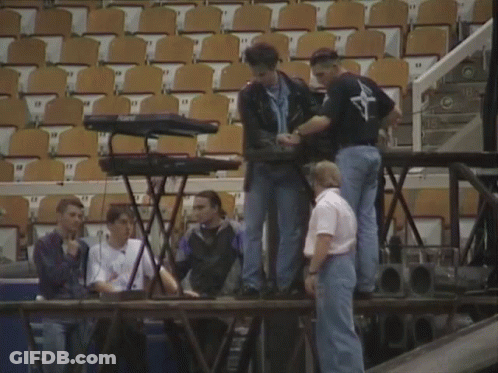 Man In Brooklyn Shirt Typing On Keyboard GIF