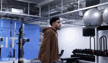 Man In Brown Hoodie In Gym GIF