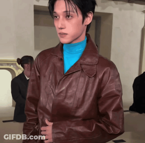 Man In Brown Jacket And Blue Prada Turtleneck GIF