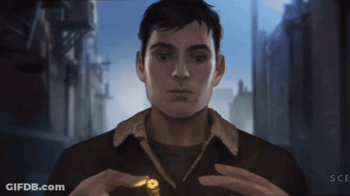 Man In Brown Jacket Holding Bullet With Letters SCE GIF