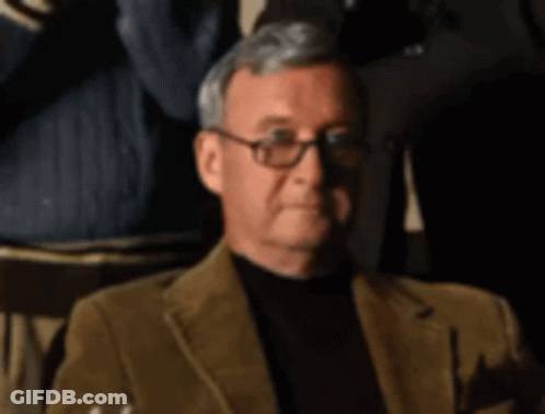 Man In Brown Jacket Holding Glass Of Whiskey GIF
