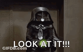 Man In Brown Jacket Holding Lightsaber Saying Look At It GIF