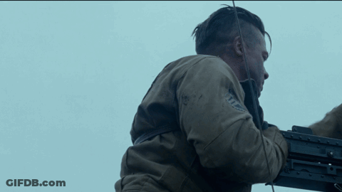 Man In Brown Jacket Holding Machine Gun GIF