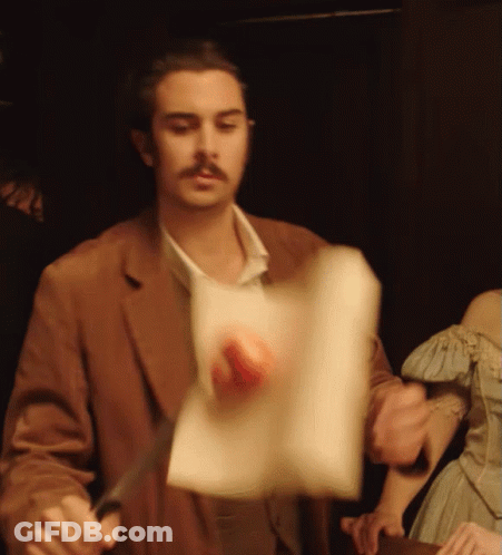 Man In Brown Jacket Holding Paper GIF