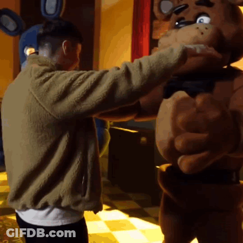 Man In Brown Jacket Hugging Teddy Bear Costume GIF