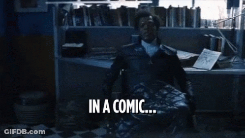 Man In Brown Jacket In Front Of Bookshelf GIF